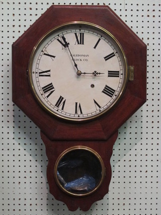 A drop dial wall clock with 11" dial with Roman numerals  marked Caledonian Clock Co.