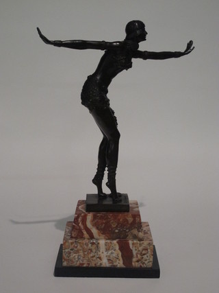 An Art Deco style bronze figure of a dancing girl, raised on a stepped marble base 19"