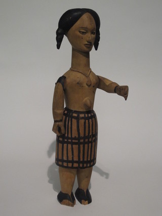 An Eastern carved wooden figure of a standing girl 25"