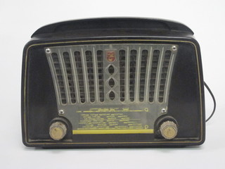 A Phillips portable radio contained in a black Bakelite case