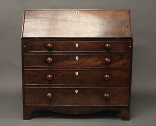 A Georgian mahogany bureau, the fall front revealing a well  fitted interior above 4 long drawers with ivory shield shaped  escutcheons and tore handles, raised on bracket feet 40"