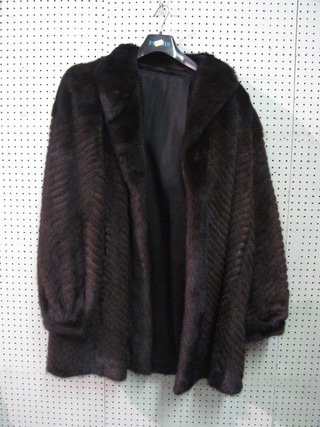 A lady's black three-quarter length fur coat by Konrad Furs