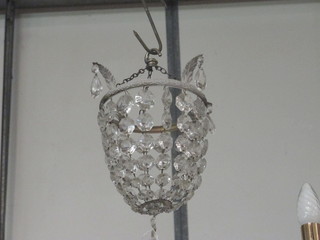 A circular bag light fitting hung lozenges