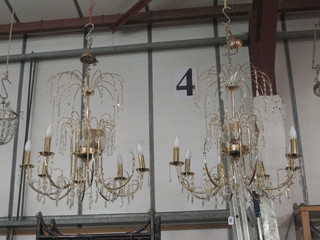 A pair of 8 light gilt metal light fittings hung glass lozenges