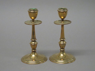 A pair of brass candlesticks 7"