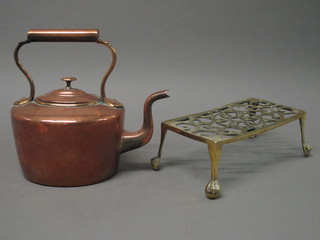 A rectangular pierced brass footman together with a copper kettle