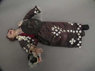 A costume doll in the form of a Pearly Queen