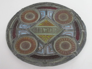 A circular Victorian stained glass panel, the centre marked Guinavare, 11", cracked,