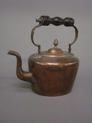A copper kettle with turned wooden handle