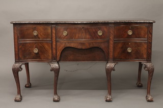 A Chippendale style serpentine fronted mahogany sideboard fitted  2 long drawers flanked by a double cupboard and drawer, raised  on cabriole ball and claw supports 60"