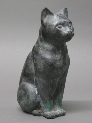 A verdigris metal figure of a seated cat 9 1/2"
