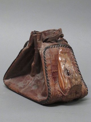 A crocodile hand bag