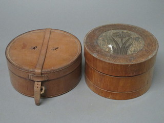 A circular leather collar box and an Art Nouveau style turned wooden collar box