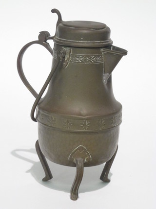 An Art Nouveau Continental copper jug with hinged lid, raised on 3 panelled supports