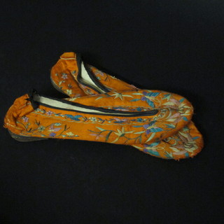 A pair of Oriental embroidered silk slippers 10"