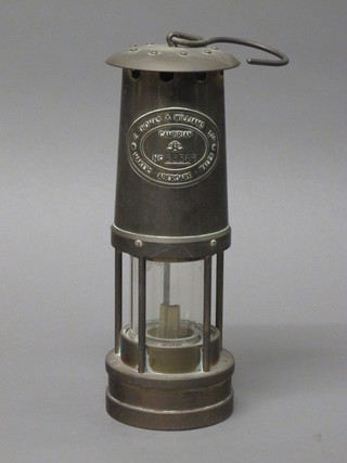 A miners safety lamp by E Thomas & Williams of Cambrian