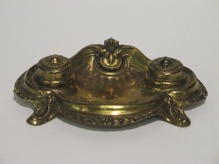 An Art Nouveau gilt metal twin bottle inkwell with ceramic bottles, the base marked Depose, 8 1/2"