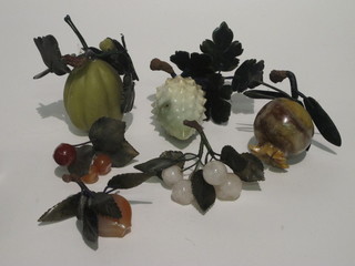 A collection of various Oriental carved hardstone fruit