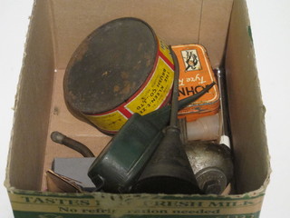 A miniature oil can and a collection of curios