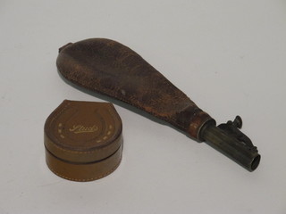 A leather horse shoe shaped collar box together with a brass and  leather shot flask