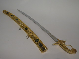 An Arabian gilt metal sabre with 30" blade