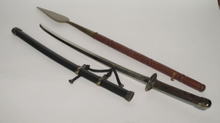 A reproduction Japanese Kutana together with a spear