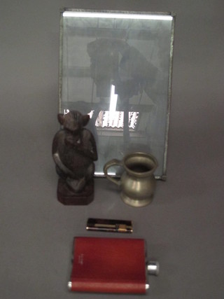 A pewter easel photograph frame 11" x 8", a Ronson lighter, a hip flask, a pewter baluster shaped measure, a carved wooden  figure of a monkey