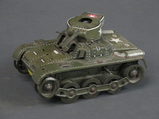 A Japanese clockwork tin plate model of an American tank, back missing