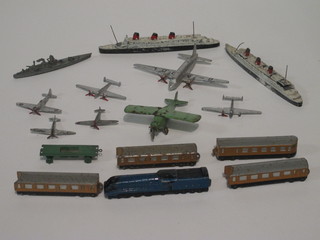 2 Dinky Toy models - The Queen Mary, a Dinky locomotive  with 4 carriages, a Dinky battle ship and 6 Dinky aircraft