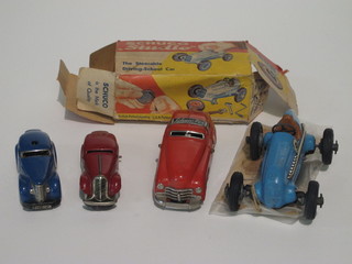 A 1930's Schuco Studio racing car boxed with instructions and starting handle winder, together with 3 other 1930s/40s Schuco  cars
