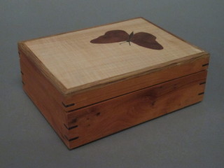 A rectangular trinket box the lid inlaid a butterfly 8"