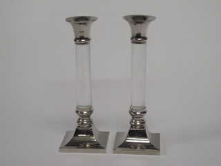 A pair of chrome and perspex candlesticks 8"
