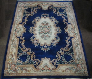 A blue ground and floral patterned Chinese carpet 122" x 97"