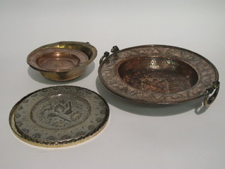 An Eastern embossed copper twin handled dish with old repair to  the centre 15", a brass Eastern sieve 10", a copper bowl and 2  Eastern trays