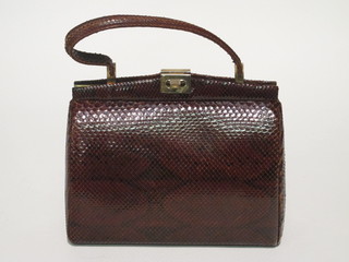 A lady's crocodile hand bag together with a purse