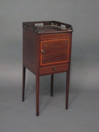 A Georgian mahogany bedside table with pierced three-quarter gallery, the base fitted a cupboard enclosed by a panelled door  above 1 long drawer, raised on square supports 13"