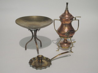 A brass chamber stick, a brass and copper bowl, an Eastern  planished copper urn on stand complete with burner