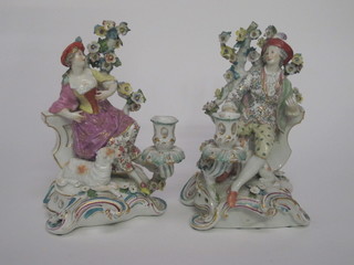 A handsome pair of 19th Century Samson porcelain candlesticks  supported by a figure of a Shepherd and Shepherdess, 10",  having gold anchor marks to the base