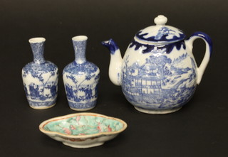 An Oriental blue and white teapot decorated pagodas and  landscape 2", 2 Oriental club shaped vases 3" and a small dish 3"