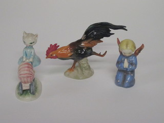 A Goebel figure of a running cockerel 7", do. figure of a cat  pushing pram with child 5" and a kneeling praying Angel 4"