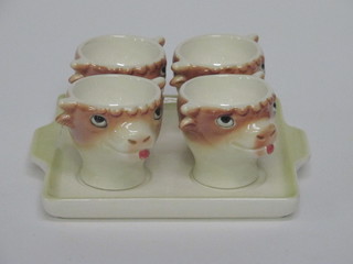 A Goebel 4 piece egg cruet on stand, the cups in the form of  cows heads