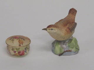 A Royal Worcester circular miniature jar and cover with floral decoration the base with green Worcester mark and 11 dots 1",  chip to rim and do. figure of a wren 313198 2"