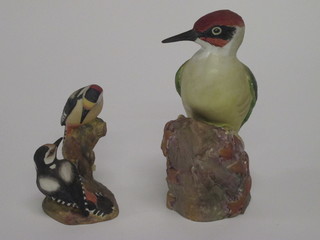 A Royal Worcester figure of a Woodpecker 3249 7" and a do.  figure of 2 Pied Woodpeckers 3363 4"
