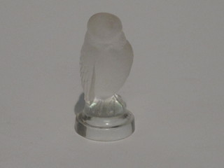 A Lalique paperweight in the form of a seated bird, the base  marked Lalique France 2 1/2"