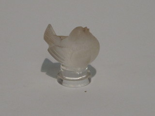 A Lalique paperweight in the form of a seated bird, 1"