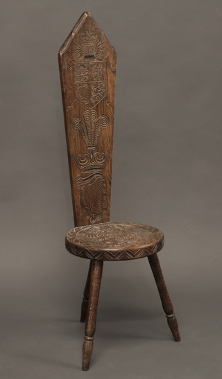 An oak spinning chair, carved the arms of The Prince of Wales,  the back marked carved by hand at the studio of Art & Antiquity  Torbay Devon,