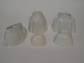 A 19th Century white glazed jelly mould in the form of a hare, 2 Shelley jelly moulds and 2 small jelly moulds