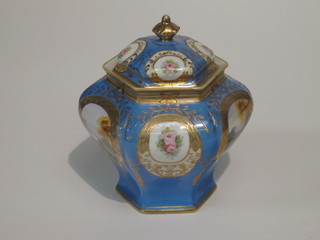 A Noritake octagonal blue glazed and floral patterned urn and  cover 7"
