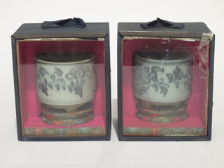 A pair of Oriental blue and white cylindrical urns 3"