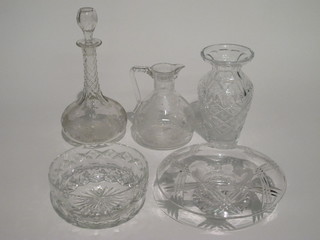 An etched glass jug 7", a mallet shaped decanter and stopper 12",  a cut glass vase 8" and 2 cut glass bowls